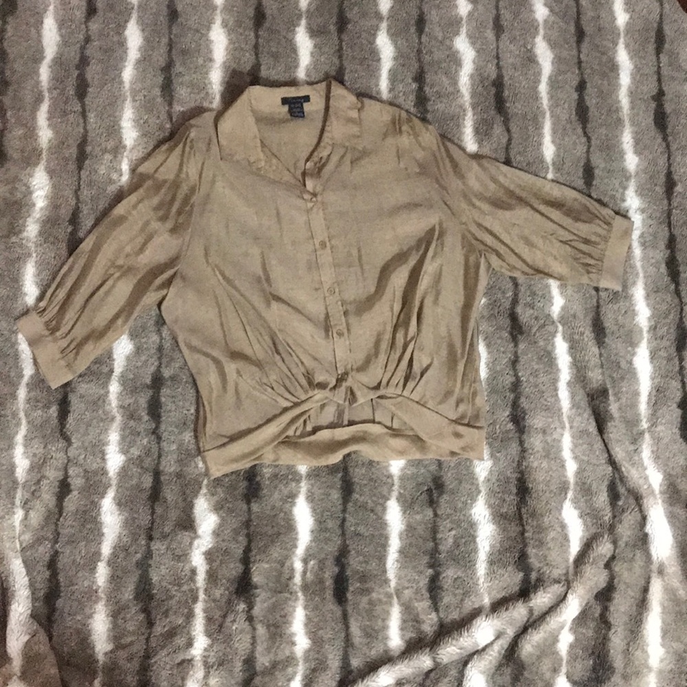 Gold blouse.